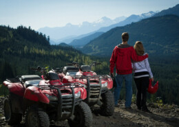 ATV riders take a break to admire Whistler's Callaghan Valley